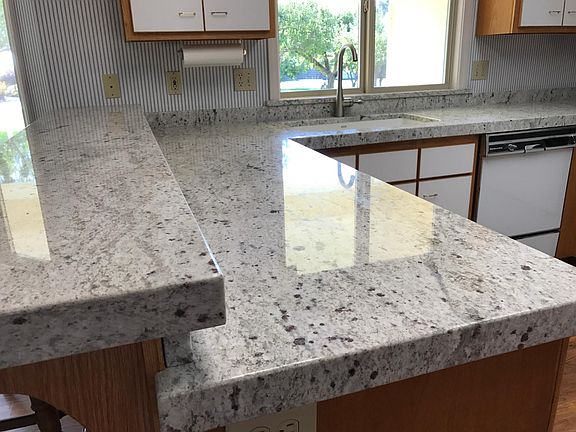 new granite counter top and new large sink and faucet