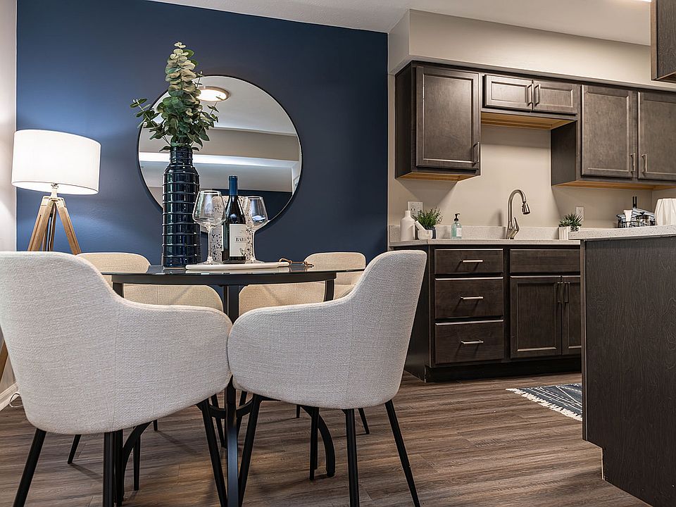 Kitchen and dining area with hardwood-style flooring