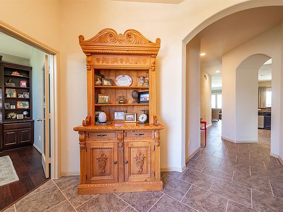 As you enter the foyer you are greeted with graceful architectural lines which add to the homes charm.