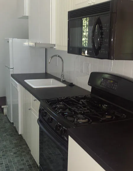 12. Galley kitchen toward rear stair