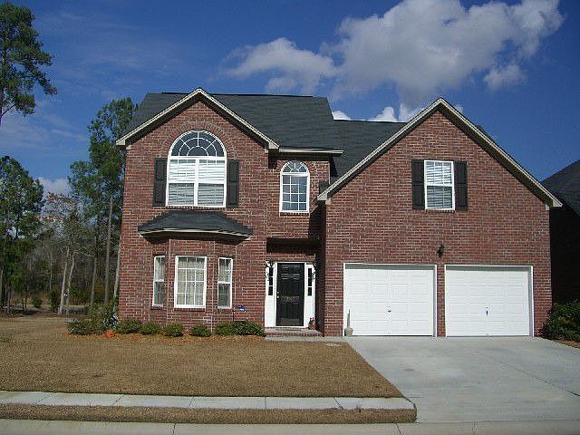 The Carolina Plan with custom built sunroom.