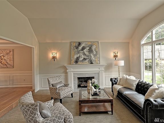 Buchan built home w/elegant formal living room, high ceilings, wainscoting & mantel.  
