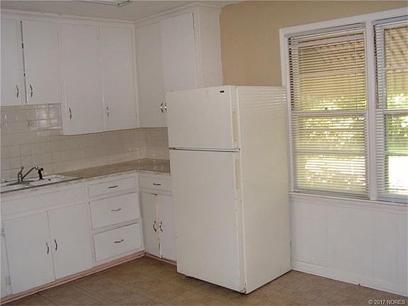 Large kitchen opens to utility room