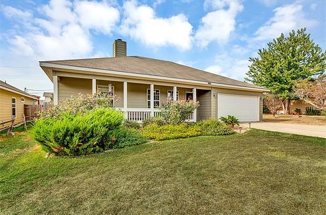 Landscaped front yard of this charming home.