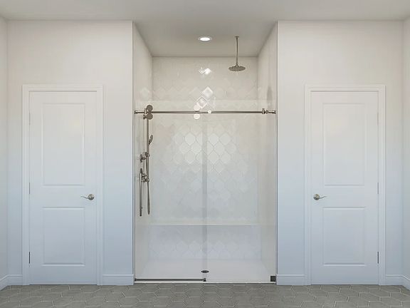Primary bath with tile and glass shower