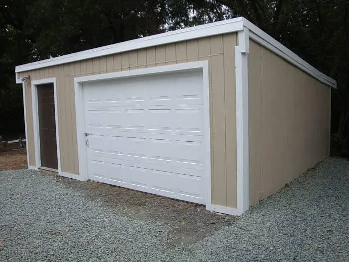 garage will fit 1 small to medium sized car, storage on the side