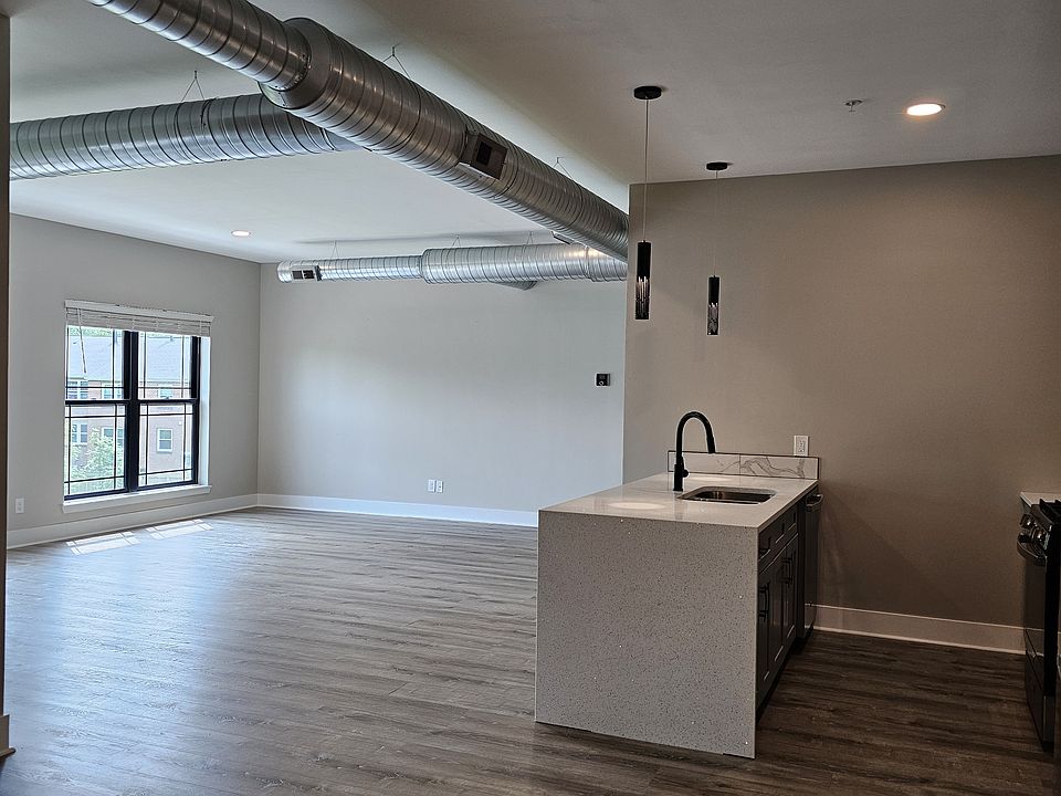 View of kitchen and living room from entry