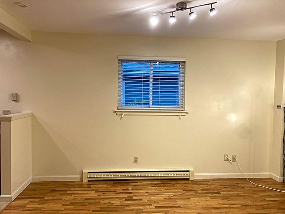 The living/dining room stretches into the open kitchen, creating a spacious living area that runs the length of the home!