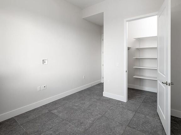 Signature Collection Three-bedroom apartment with custom closet shelving system