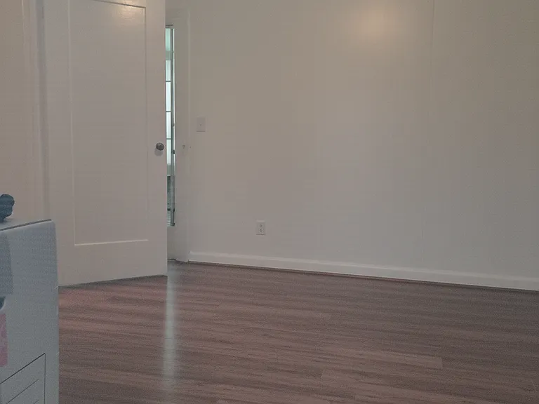 Second bedroom with huge closet and lots of windows. hardwood floors.