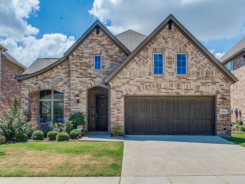 Two car garage with EV charger port and a cool front porch!