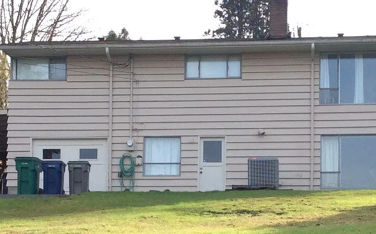 Back of home with access off SW 182nd St, Garage parking and Carport parking, nice large back yard
