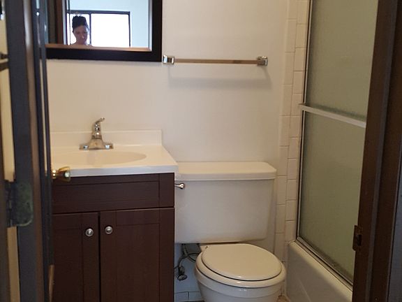 bathroom with tub and shower