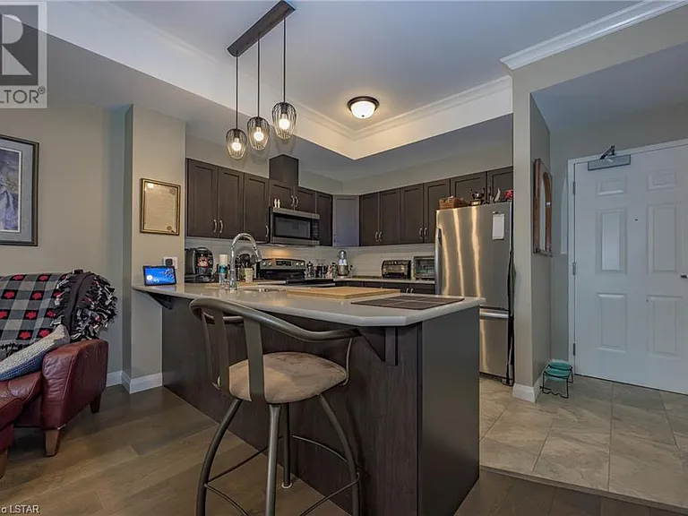 Overhang countertop great for entertaining guests.