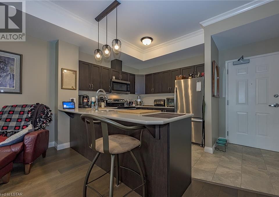 Overhang countertop great for entertaining guests.