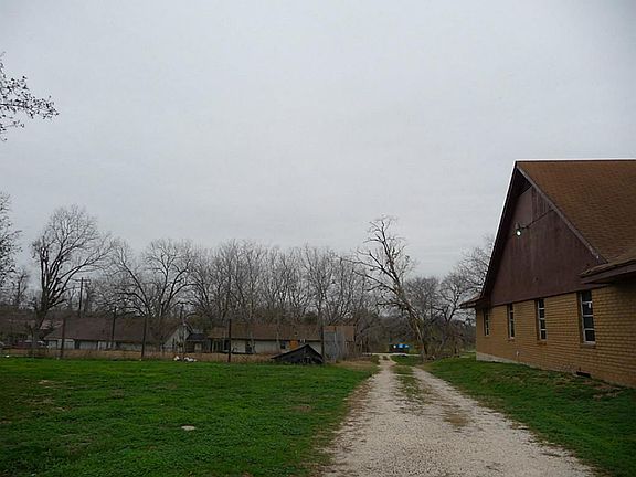 ENTRANCE FROM THE BACK NEXT TO CHURCH. THIS COULD BE AN EXCELLENT PARKING FOR BUSINESSES NEAR BY