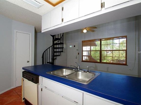 view from inside kitchen to front door and living room