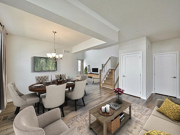 Open Living room and Dining room with hardwood floors throughout