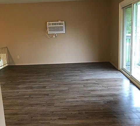 Living Room with New Wall Unit Air Conditioner