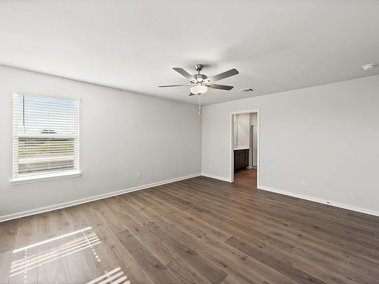 The master suite has a large bedroom, ensuite bathroom and a walk-in closet.