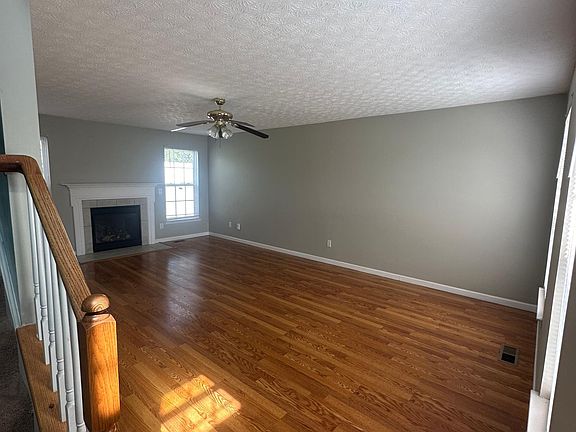 Entryway, view of the living room and partial view of stairs