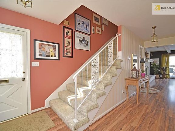 Welcoming entry! You'll appreciate the wide hallways and staircase in this home