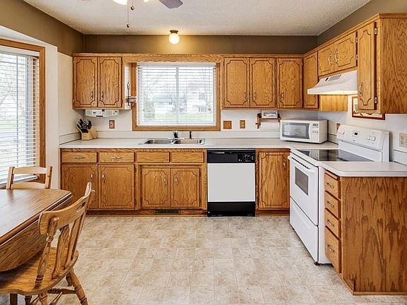 Large eat in kitchen is very clean and bright.