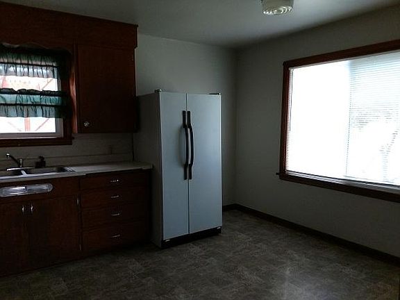 kitchen with table area and double door fridge