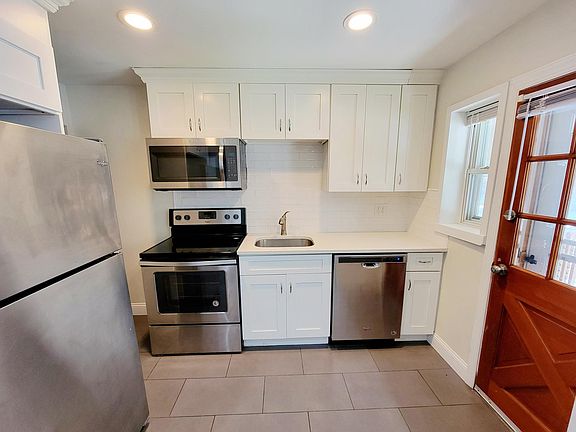 Kitchen with Quartz Countertops and Stainless Steel Appliances