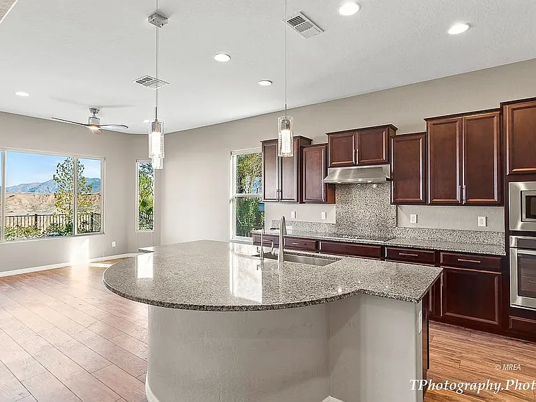 Living room, dining and kitchen have wood floor