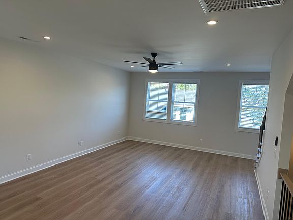 huge living room with ceiling fan