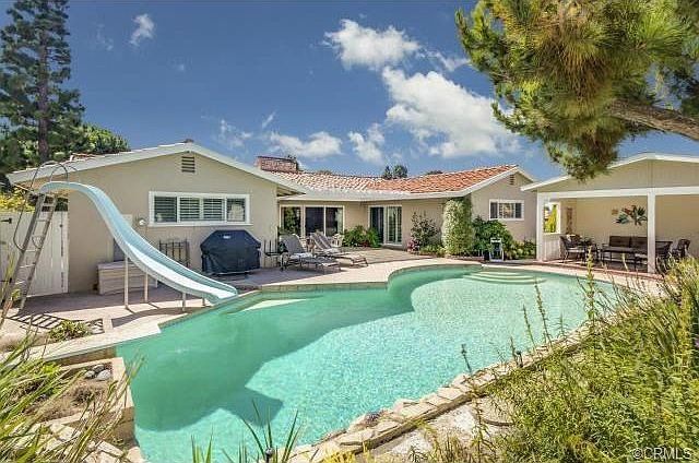 Wonderful backyard with pool and cabana is great for entertainin