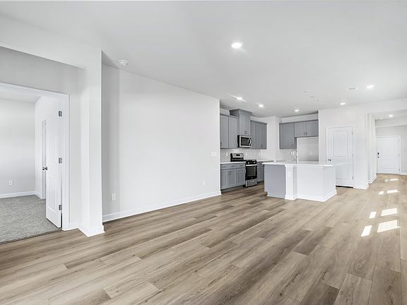 The stunning open-concept floorplan allows for easy flow between the kitchen and dining areas.