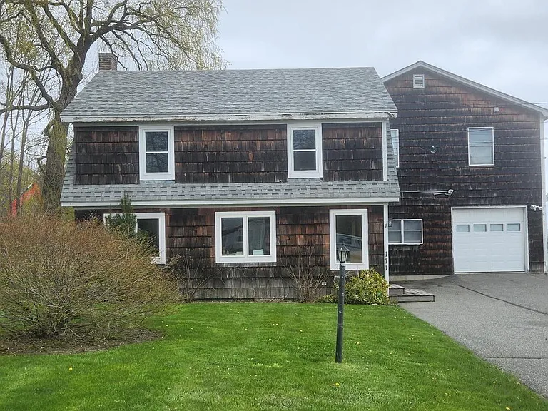 Exterior Of Unit, With Large Lawn And Flower Gardens. Off Street Parking