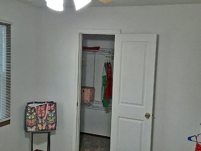 ...the larger bedroom has a small, walk-in closet with adjustable shelving...