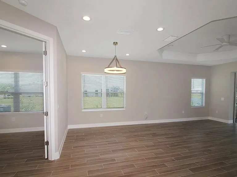 Home office double door entry. Lake View from Kitchen, Dining Room, Living Room, Lanai, and Primary Bedroom.