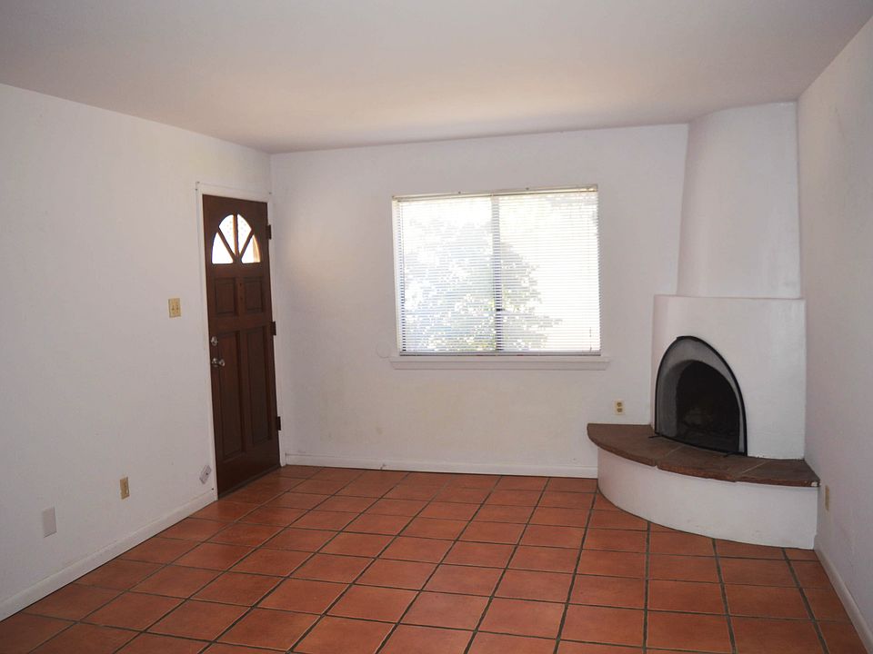 Living room with kiva fireplace.