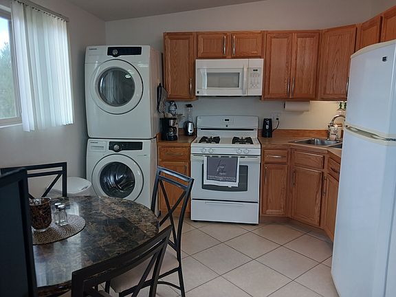 Kitchen with stacked washer & dryer