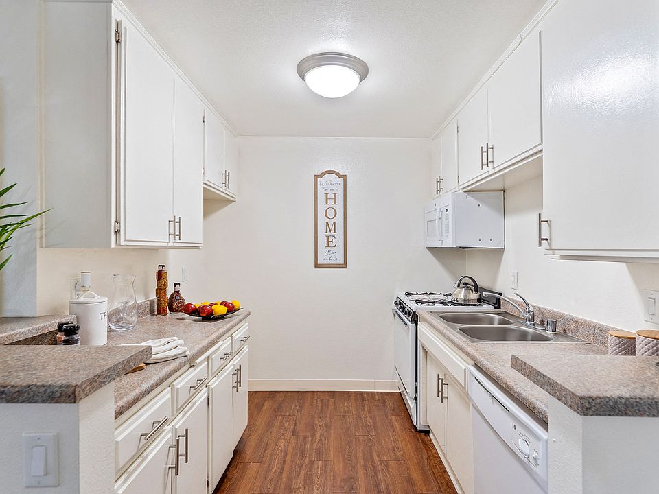 Spacious and upgraded kitchen with plank wood flooring