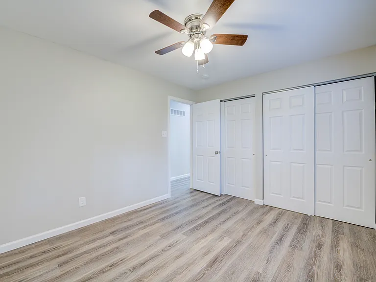 Primary bedroom is rear main floor with an extra closet space.