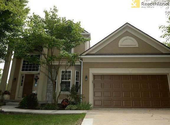 Colorful landscaping and brand new cement walk and front step.