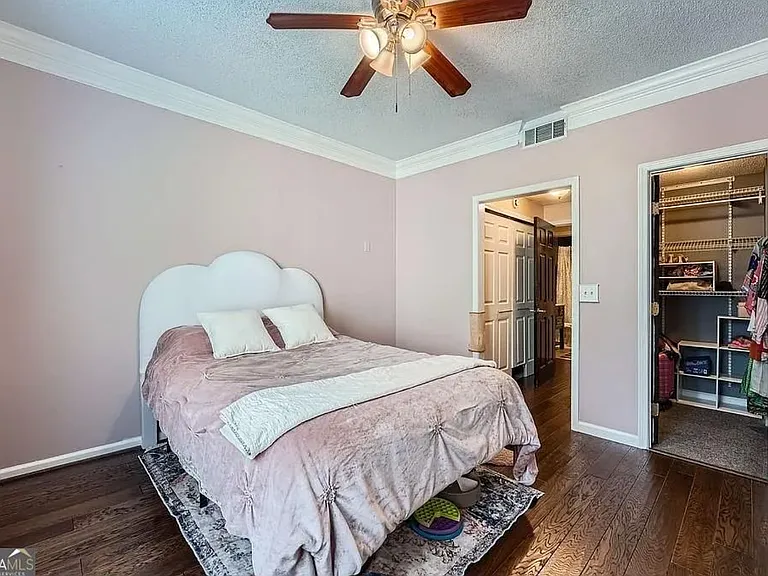 Large bedroom can accommodate any size bed and dressers.