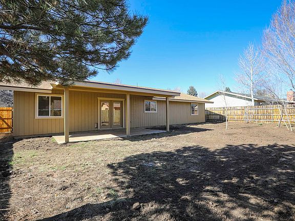Covered rear patio. Large yard.
