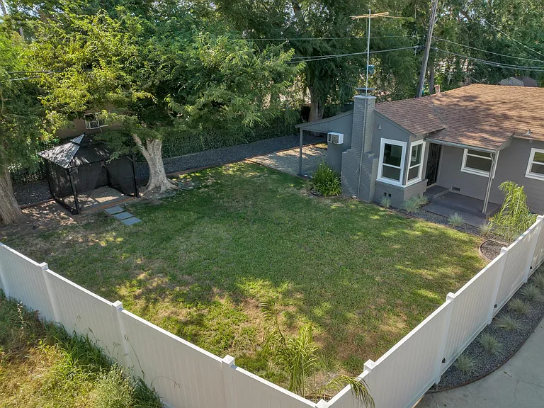 Fully enclosed yard with 6' perimeter fence along front & sides of home.