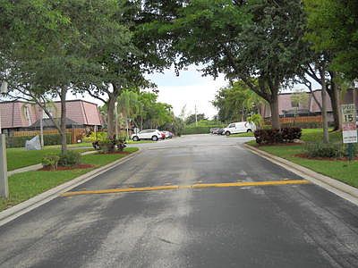 Entry into Courtyards at Boca community