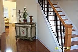 Foyer, hardwood flrs., iron Gothic spindle 