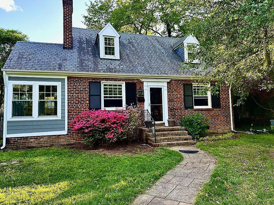 Original brick, two-story Cape Cod with consciously retained character and historical charm