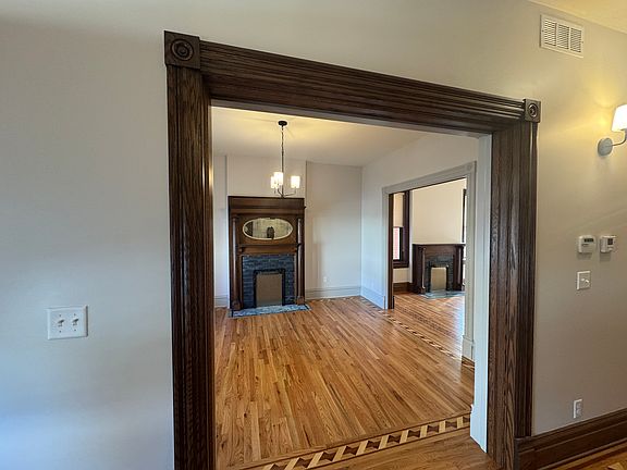View of living room with restored fireplace