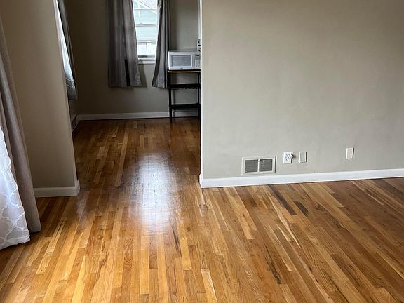 natural hardwood floors in the living and dining areas