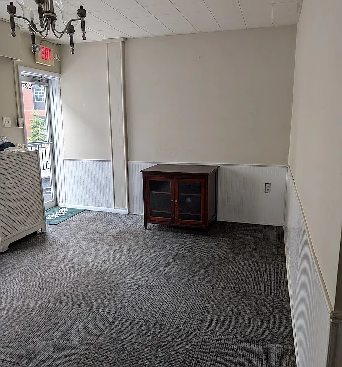 Front Room with Light from window and door. ( Bookcases and cabinet available for furnishings)